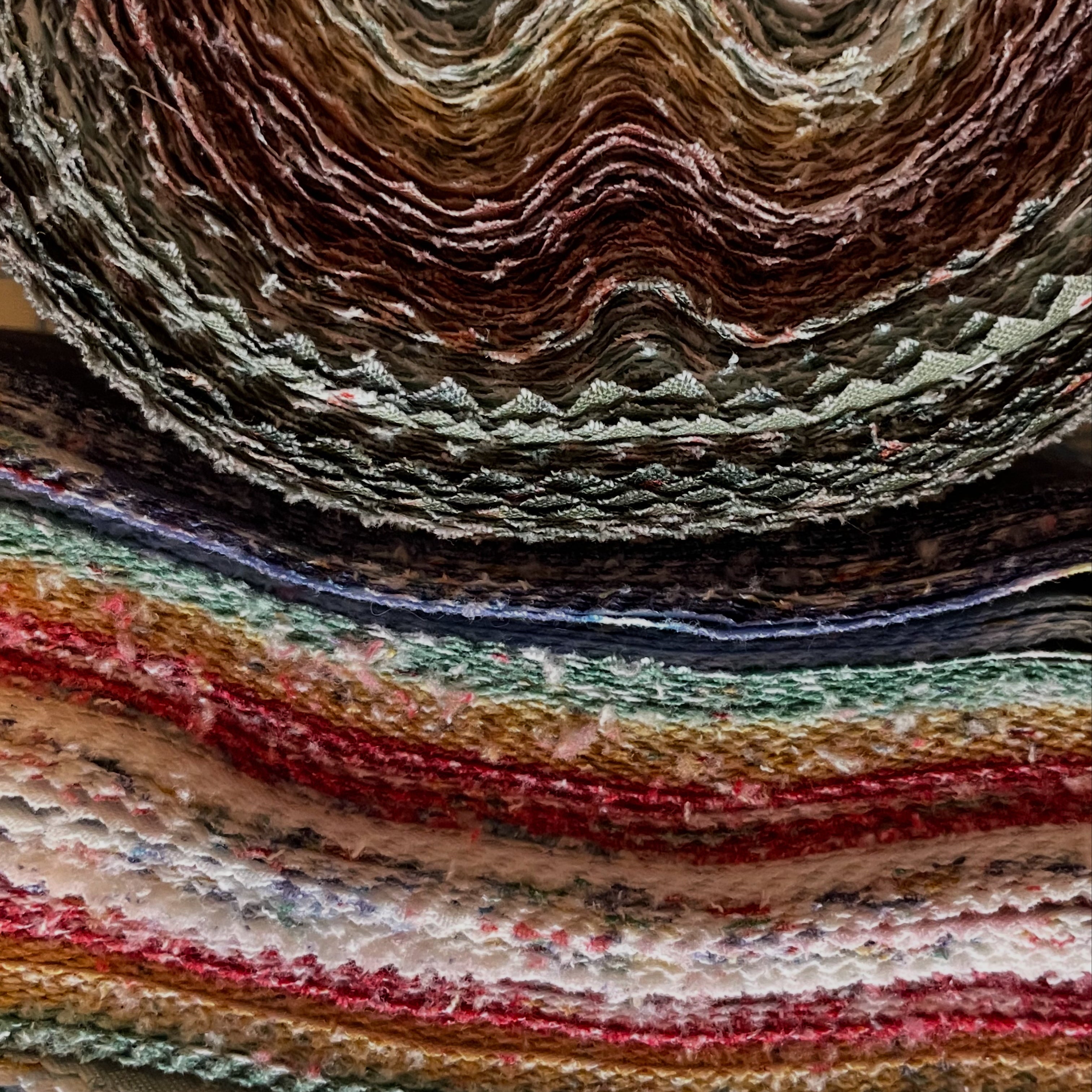 Stack of multicolored fabric swatches